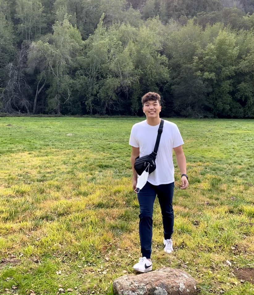 Picture of Jeremy walking through a field